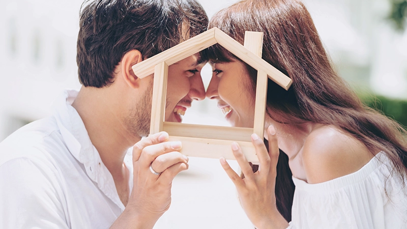 Young couple planning to buy a house and have happy living.